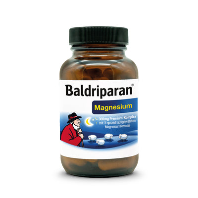 Braunes Glas mit Schraubdeckel, Etikett mit Aufschrift ‚Baldriparan Magnesium‘, Illustration eines Schäfers mit Schafen unter Sternenhimmel; Nahrungsergänzungsmittel mit 300 mg Premium-Magnesiumkomplex.